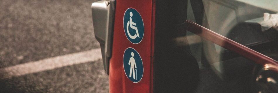 Accessibility signs on a side of a bus