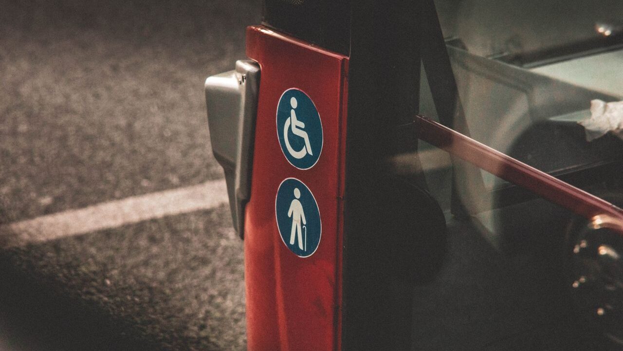 Accessibility signs on a side of a bus
