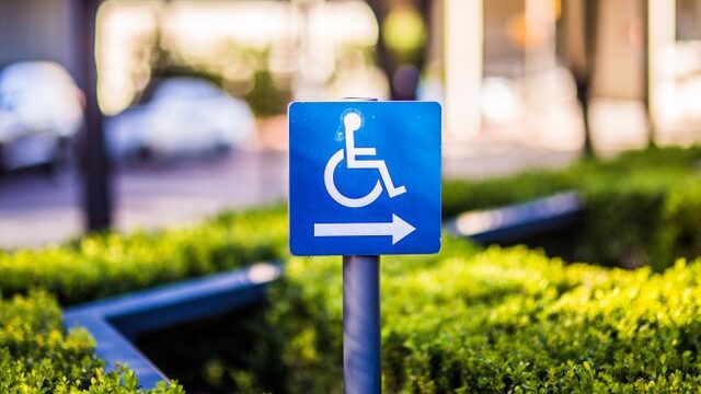Accessible parking/pathway sign with direction arrow